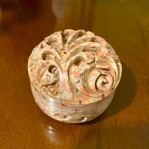 Trinket, Small jewelry holder made from stone with detailed artwork.